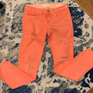 Guess distressed women’s orange skinny jeans